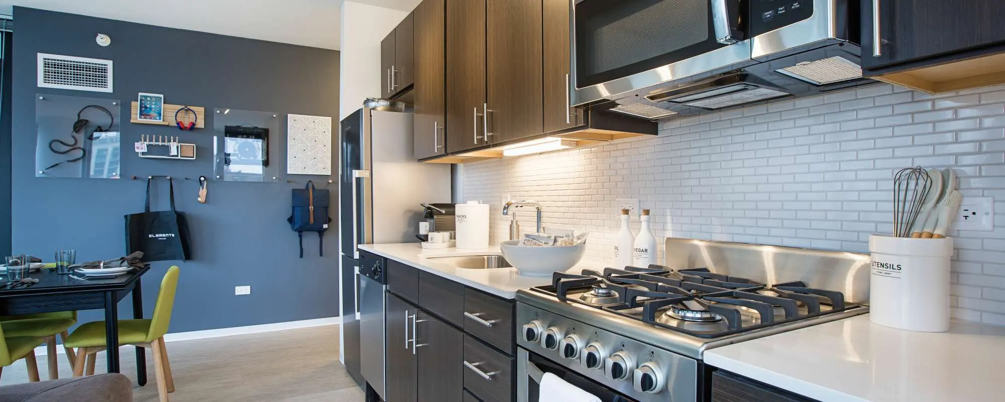 Kitchen with upscale appliances at Exhibit On Superior in Chicago, Illinois