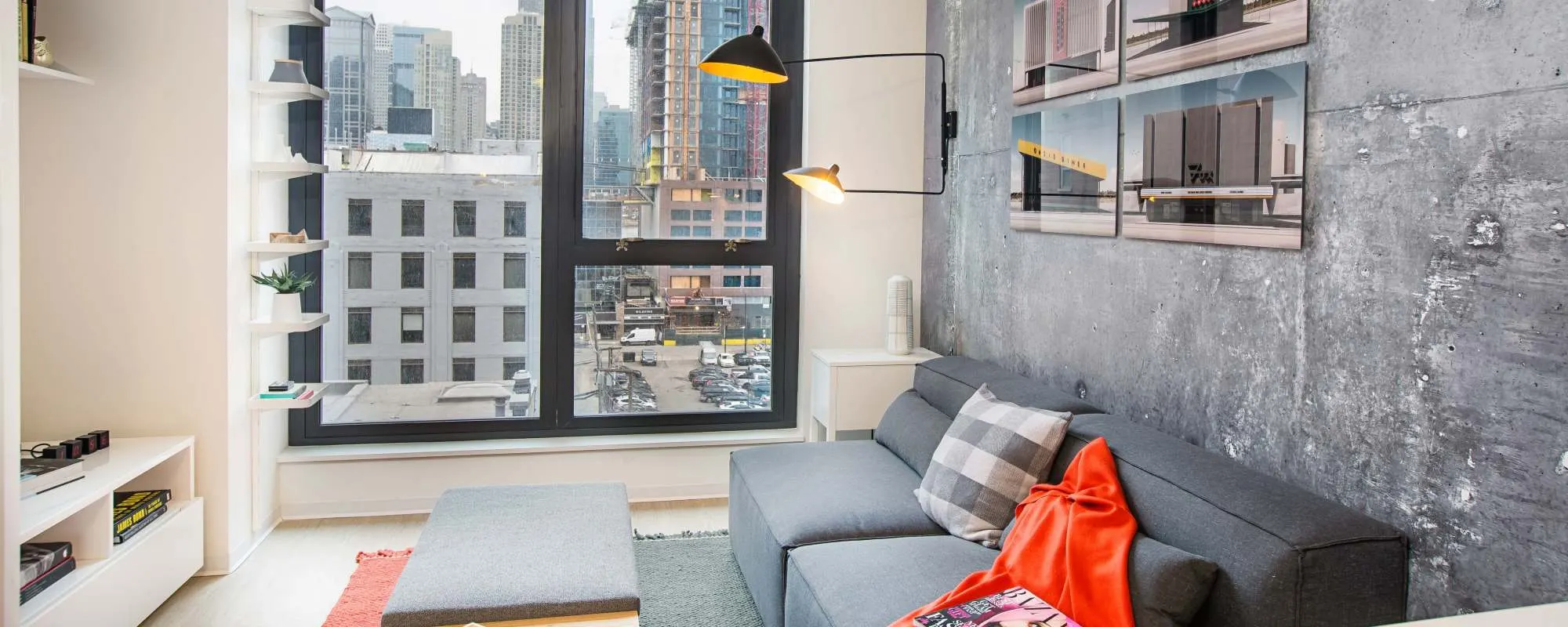 Room with large windows at Exhibit On Superior in Chicago, Illinois