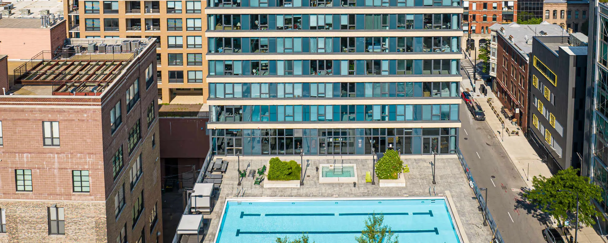 Pool and high-rise building at Exhibit On Superior in Chicago, Illinois