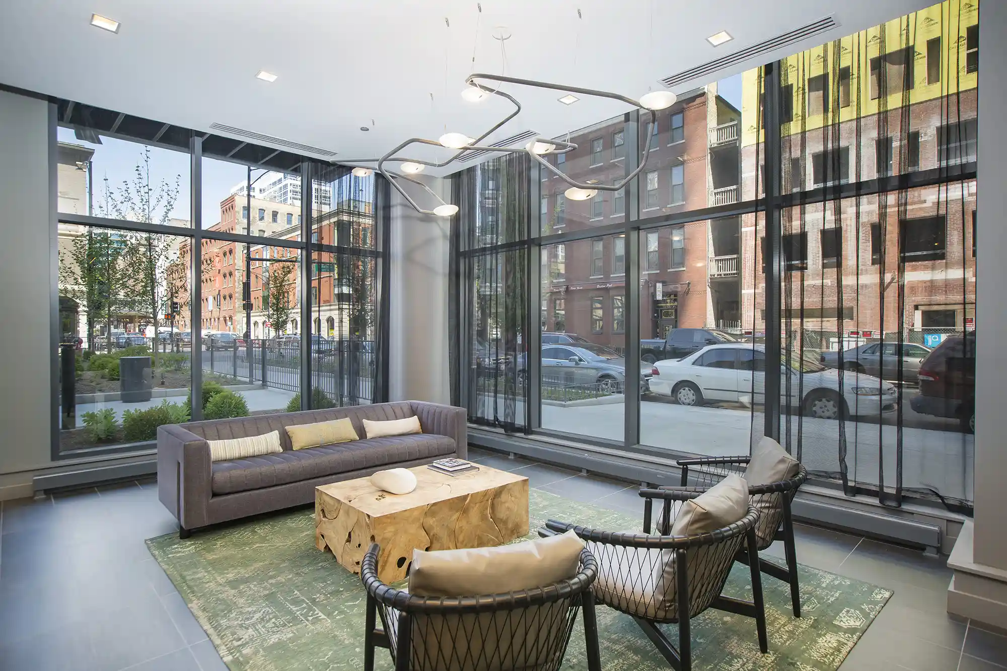 Street-level lobby seating with sculptural lighting at Exhibit On Superior